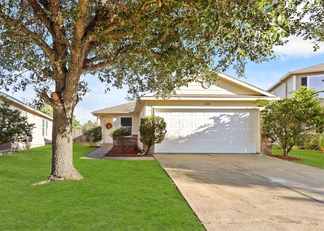 view of front of home featuring a garage and a front lawn