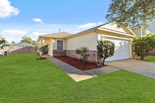 single story home with cooling unit, a garage, and a front yard