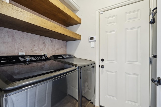 laundry room featuring separate washer and dryer