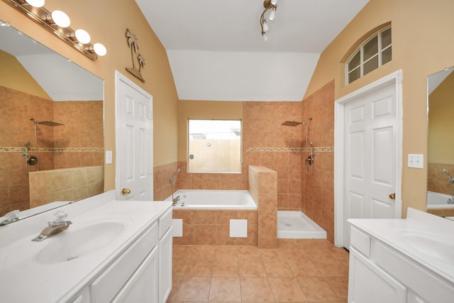 bathroom with tile patterned flooring, vanity, independent shower and bath, and lofted ceiling