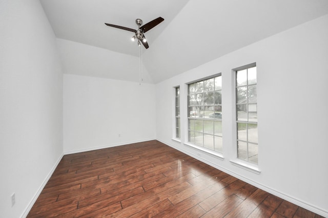 spare room featuring ceiling fan, dark hardwood / wood-style flooring, and lofted ceiling