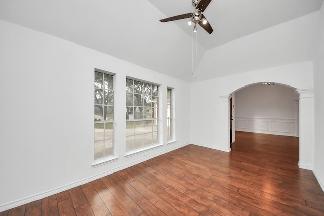 spare room featuring ceiling fan, dark hardwood / wood-style flooring, and lofted ceiling