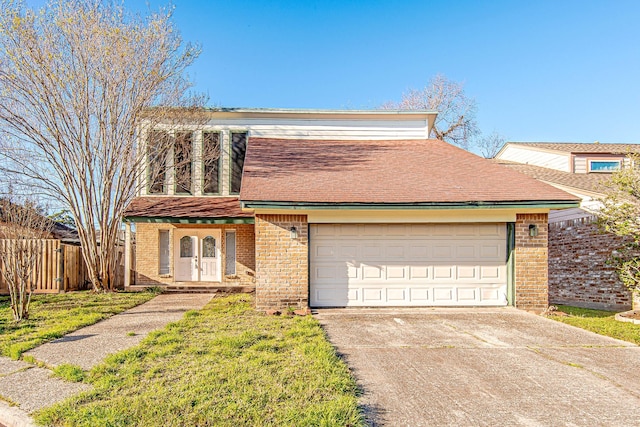 view of front facade with a garage and a front yard