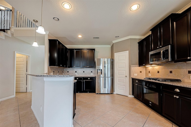 kitchen featuring light tile patterned flooring, light stone counters, and appliances with stainless steel finishes