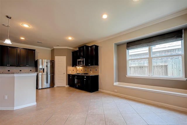 kitchen with tasteful backsplash, crown molding, light tile patterned floors, and appliances with stainless steel finishes