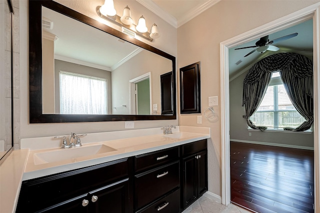 bathroom with vanity, a wealth of natural light, ceiling fan, and ornamental molding