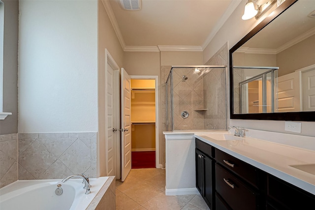 bathroom with tile patterned flooring, vanity, crown molding, and plus walk in shower