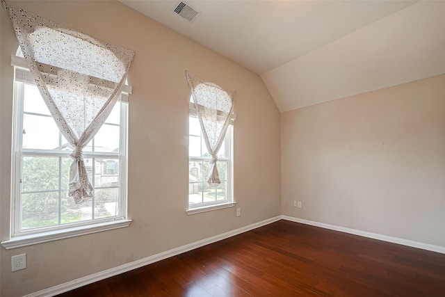 bonus room featuring lofted ceiling and dark wood-type flooring