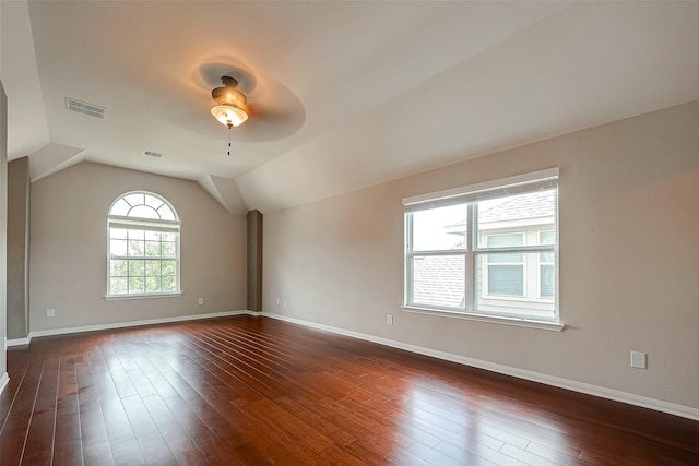 spare room with dark wood-type flooring, ceiling fan, and lofted ceiling