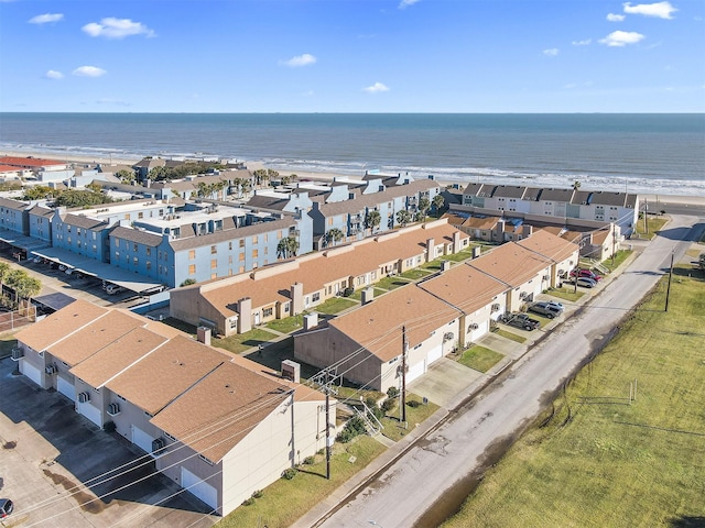 birds eye view of property featuring a water view and a view of the beach