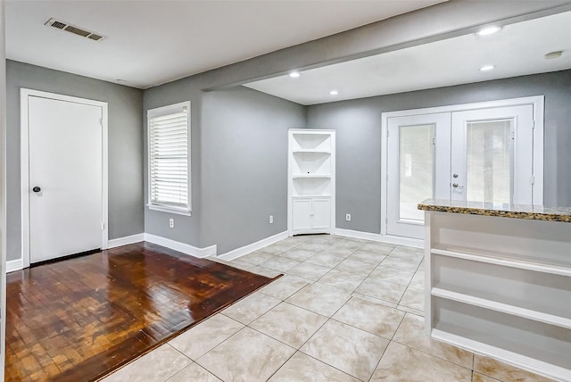 foyer with light tile patterned flooring