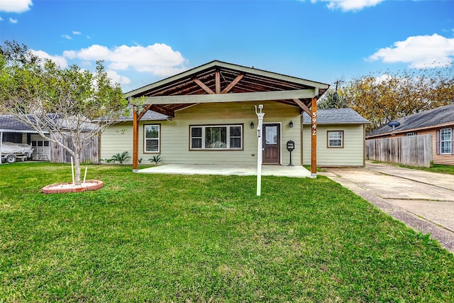 bungalow with a patio and a front yard