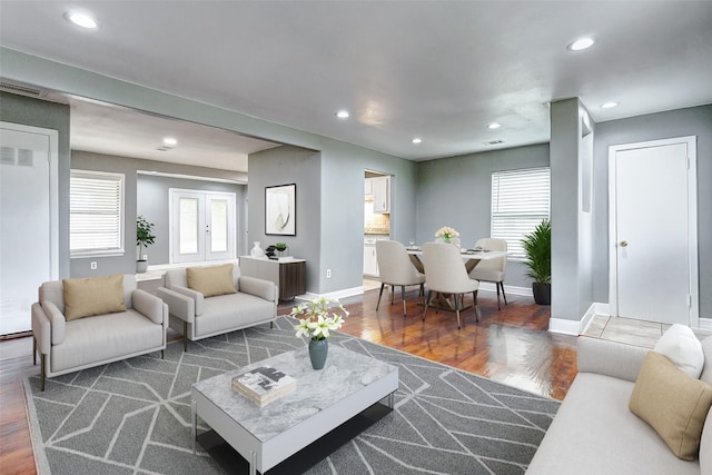 living room with dark hardwood / wood-style flooring