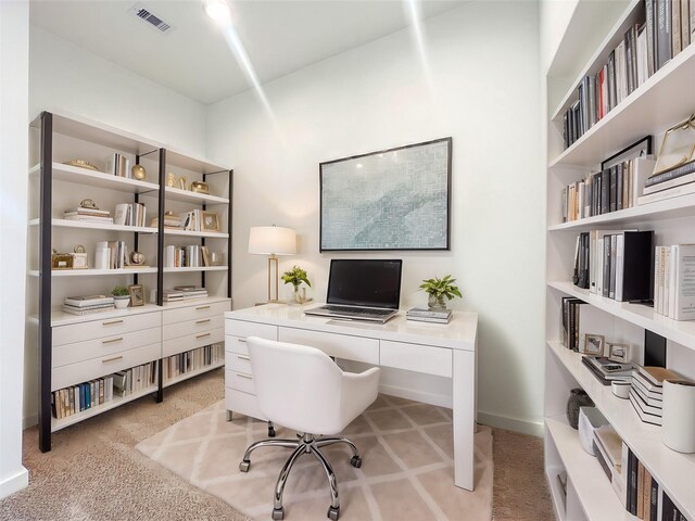 office space with light colored carpet