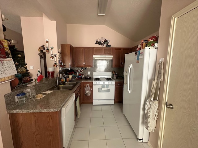 kitchen with sink, kitchen peninsula, vaulted ceiling, white appliances, and light tile patterned flooring