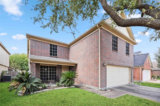 view of front of house with a front yard, a garage, and central air condition unit