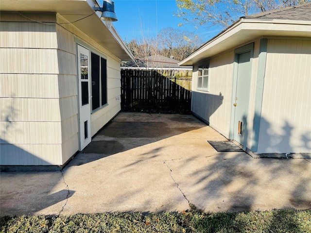 view of side of home featuring a patio