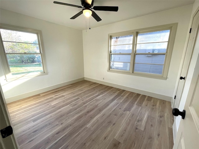 unfurnished room featuring ceiling fan and light hardwood / wood-style floors