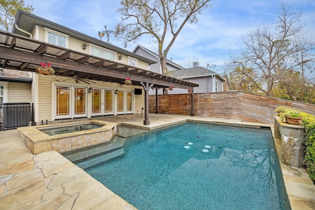 view of pool featuring an in ground hot tub, a patio area, and a pergola