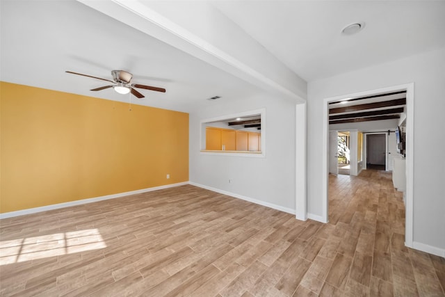 unfurnished room featuring beam ceiling, light hardwood / wood-style flooring, and ceiling fan