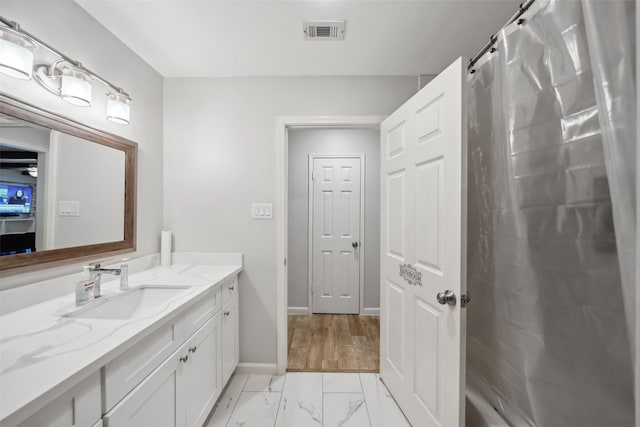 bathroom with vanity and walk in shower