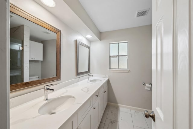 bathroom with vanity and toilet