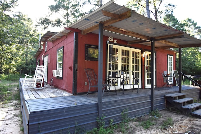 exterior space featuring cooling unit and a wooden deck