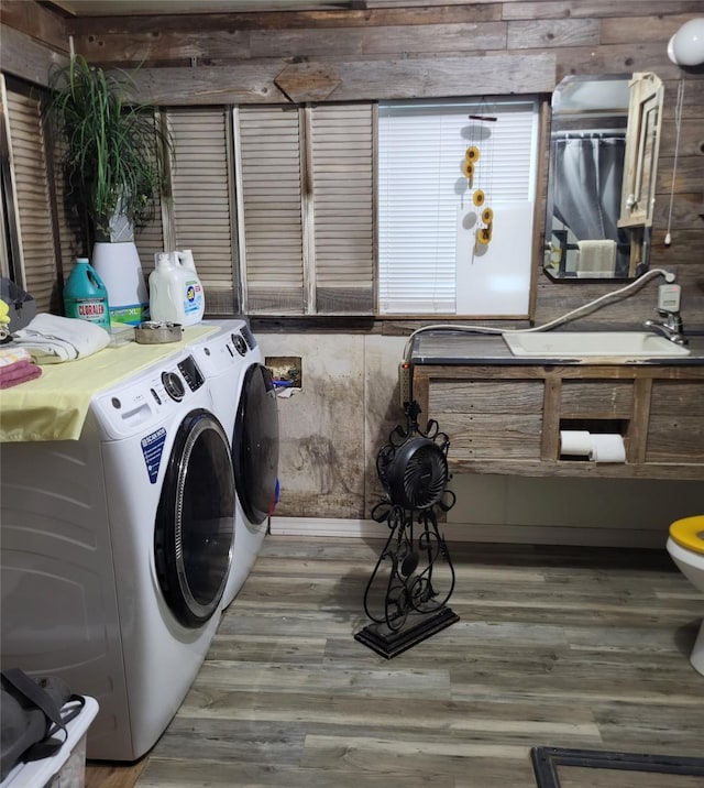 clothes washing area featuring separate washer and dryer