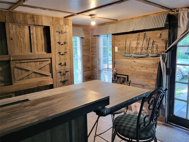 dining space with wooden walls