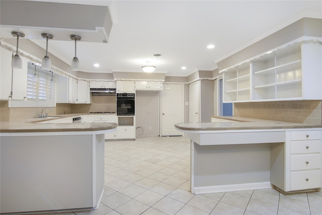 kitchen with white cabinetry, hanging light fixtures, backsplash, kitchen peninsula, and oven