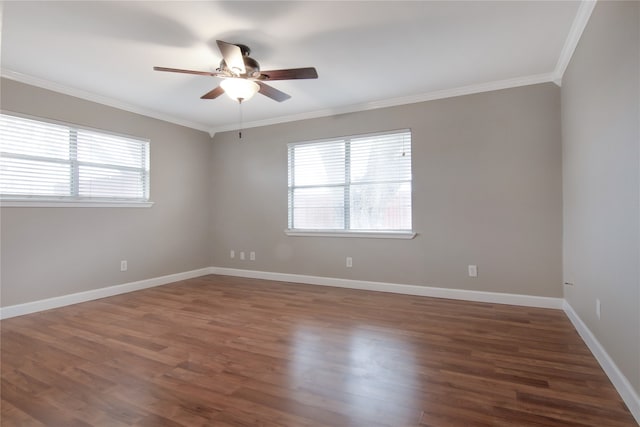 spare room featuring dark hardwood / wood-style floors, ceiling fan, and ornamental molding