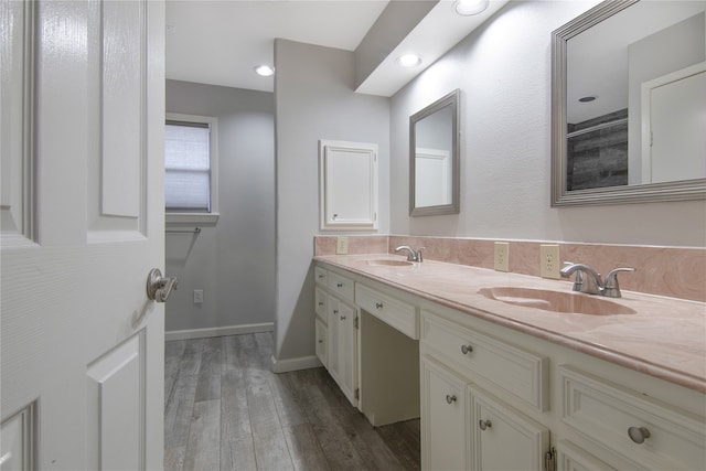 bathroom with vanity and hardwood / wood-style flooring