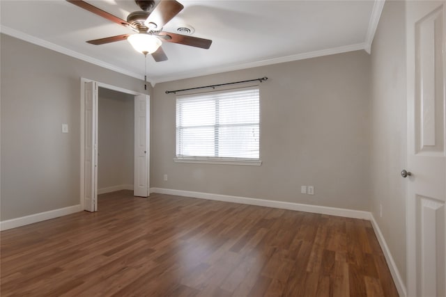 unfurnished bedroom with dark hardwood / wood-style flooring, ceiling fan, and ornamental molding