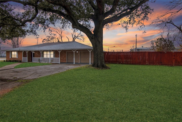 yard at dusk with a garage