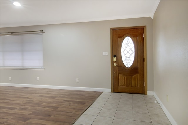 foyer featuring light hardwood / wood-style floors and ornamental molding