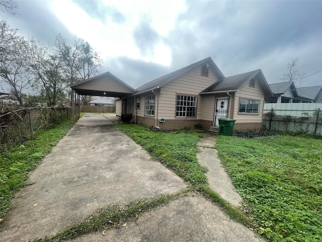 view of front of home with a carport