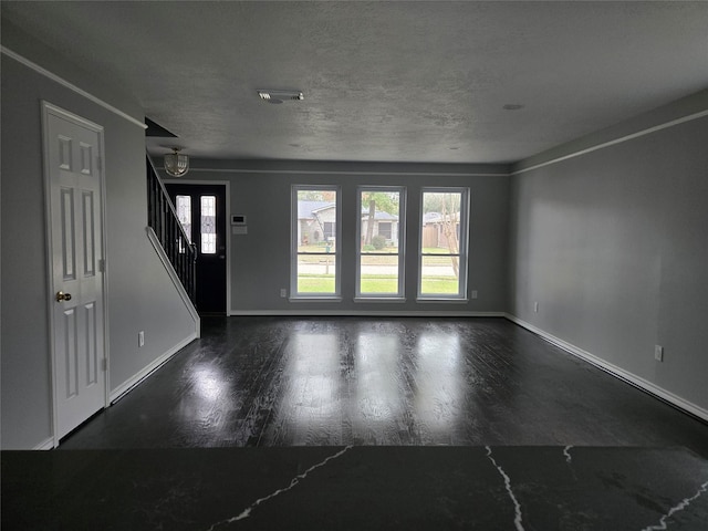 interior space featuring a textured ceiling