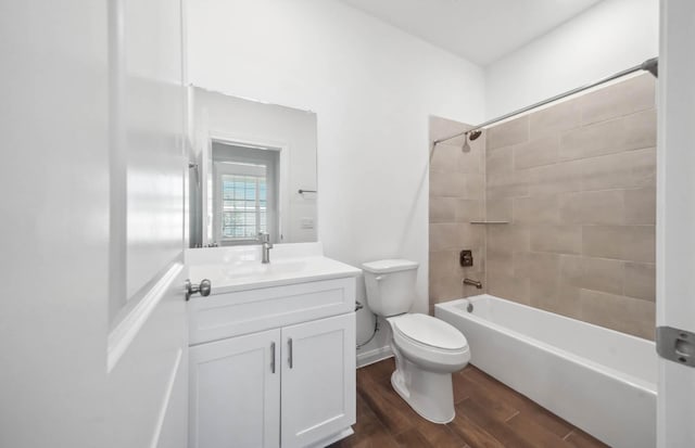 full bathroom featuring vanity, toilet, and tiled shower / bath