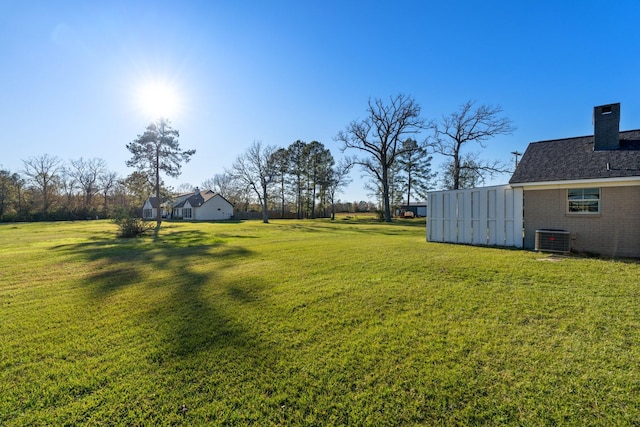 view of yard featuring central AC unit