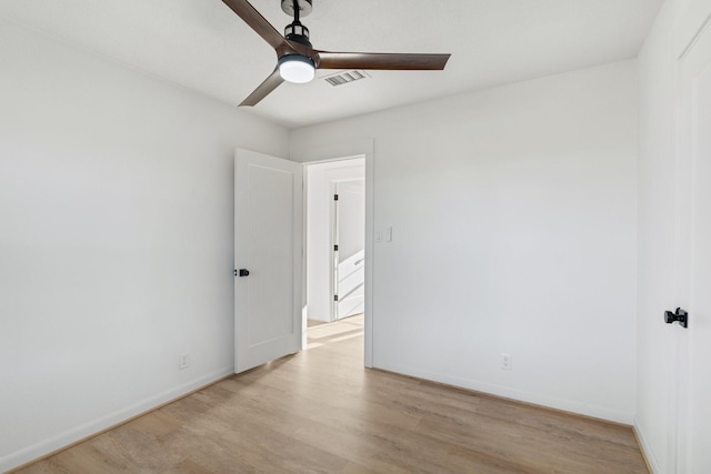 spare room with light hardwood / wood-style floors