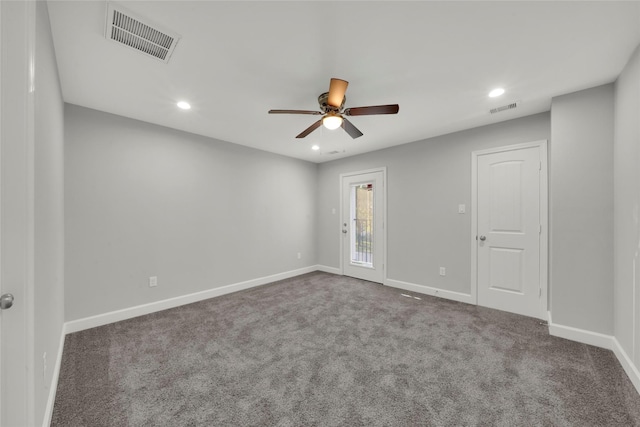 empty room with carpet flooring and ceiling fan