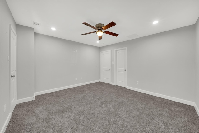 carpeted spare room with ceiling fan