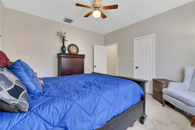 bedroom featuring light colored carpet and ceiling fan