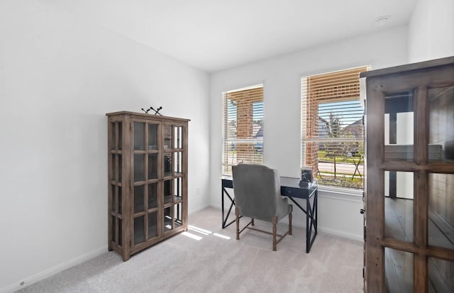 office area with light colored carpet