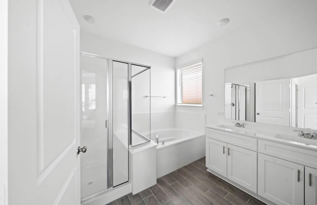 bathroom with plus walk in shower and vanity