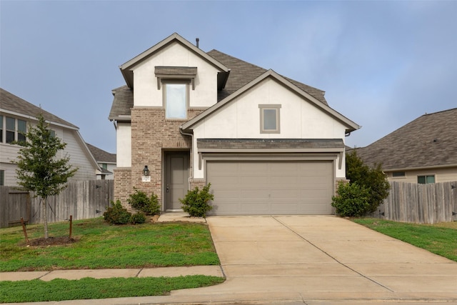 view of front of property with a garage and a front yard