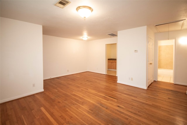 empty room featuring hardwood / wood-style flooring