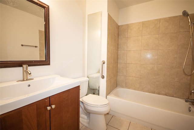 full bathroom featuring tile patterned floors, vanity, tiled shower / bath, and toilet