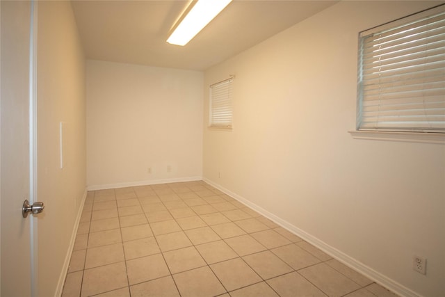 empty room with light tile patterned floors