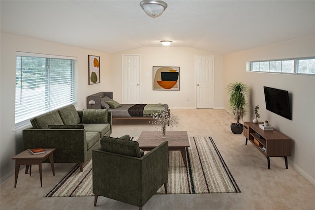 living room with light carpet and vaulted ceiling